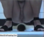 A voyeuristic video in which an Italian woman is filmed taking a nice-sized dump into a floor toilet at a public restroom.